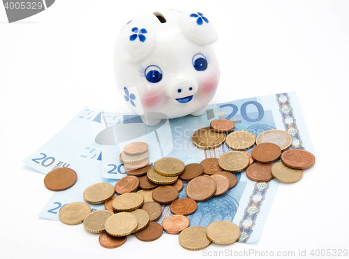 Image of coins and euro with piggy bank