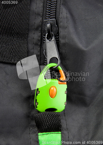 Image of Green lock on a bag\'s zipper