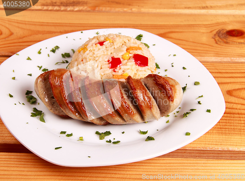 Image of fried rice with vegetables and cut sausage