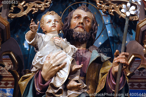 Image of Saint Joseph holding baby Jesus