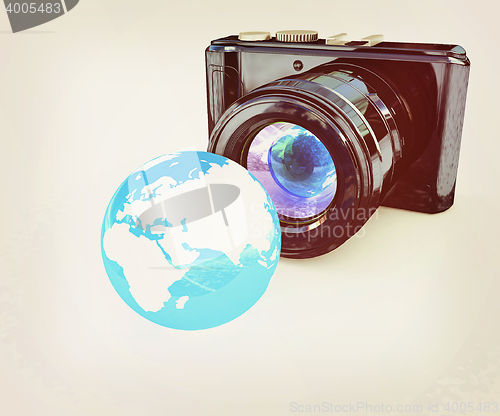 Image of 3d illustration of photographic camera and Earth