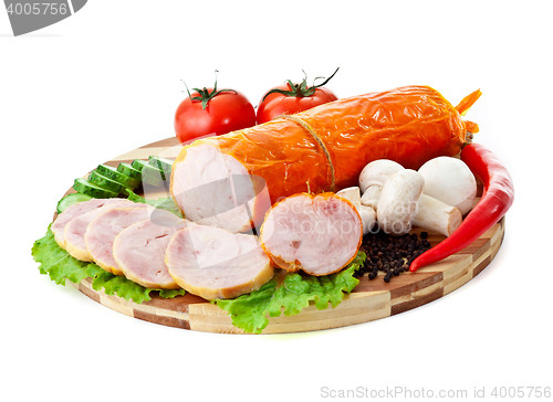 Image of sausages in coposition with vegetables