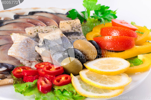 Image of fresh fish on dish with vegetables