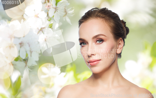 Image of beautiful young woman face over white background