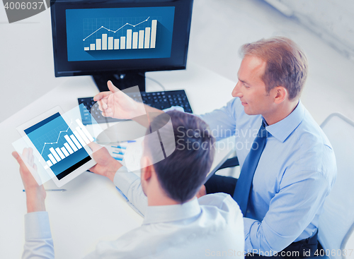 Image of businessmen with tablet pc and computer at office