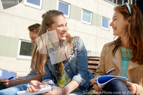 Image of group of students with notebooks at school yard