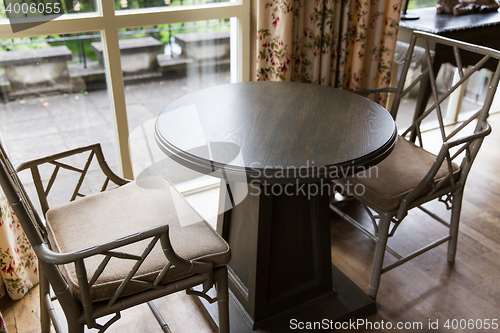 Image of close up of vintage chairs and table at home