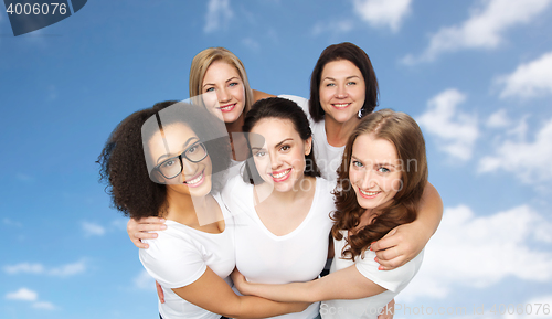 Image of group of happy different women in white t-shirts