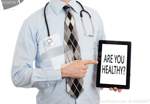 Image of Doctor holding tablet - Are you healthy?
