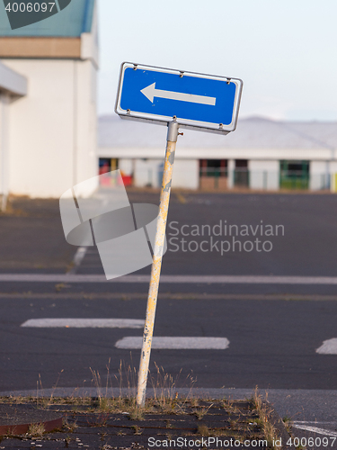 Image of Traffic sign arrow pointing left, sign on an abandoned Amarican 