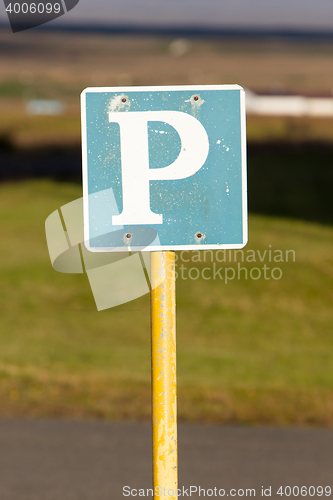 Image of Rusty, old parking sign