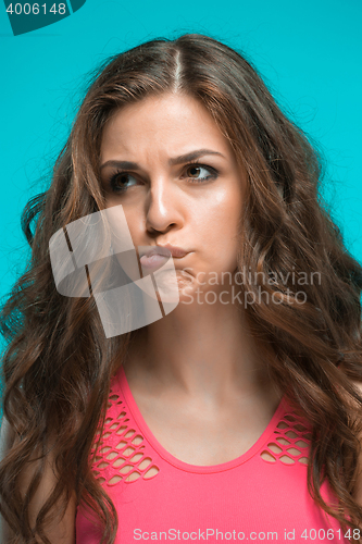 Image of The young woman\'s portrait with thoughtful emotions