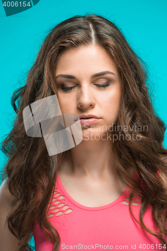 Image of The young woman\'s portrait with thoughtful emotions