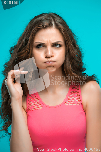 Image of The young woman\'s portrait with thoughtful emotions