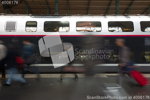 Image of People coming to or leaving train station platform.