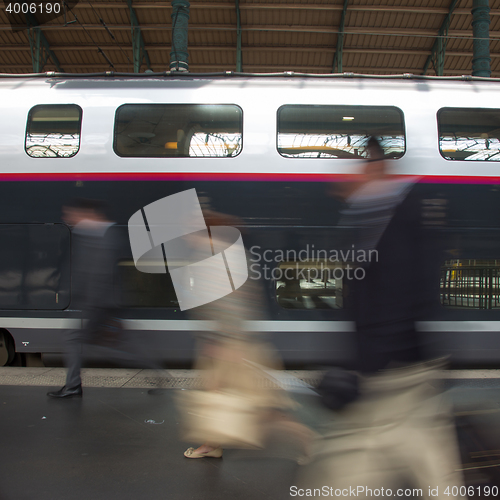 Image of People coming to or leaving train station platform.