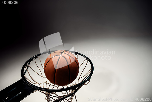 Image of Basketball board and basketball ball on gray background