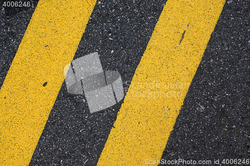 Image of Black Road Pavement with Yellow Line