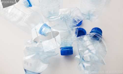 Image of close up of empty used plastic bottles on table