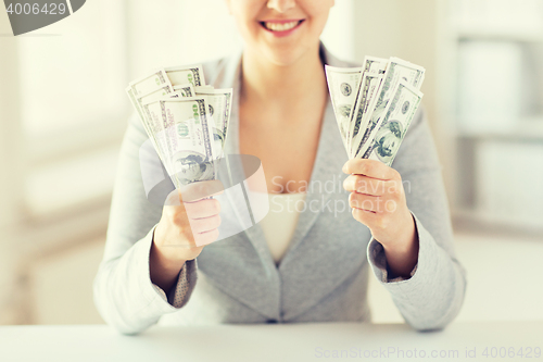 Image of close up of woman hands holding us dollar money