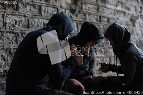 Image of close up of young people smoking cigarettes