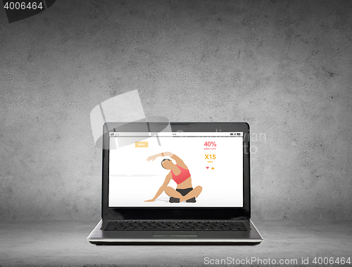 Image of laptop computer with fitness application on screen