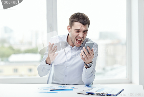 Image of close up of businessman with smartphone