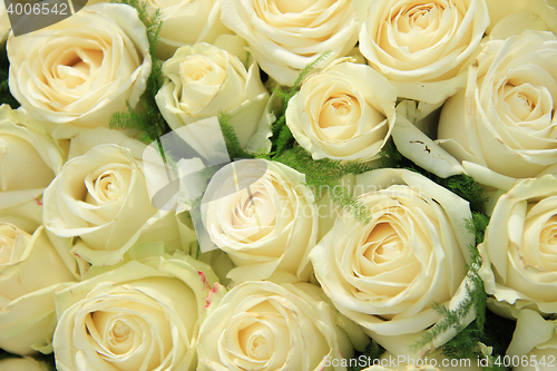 Image of White roses in a wedding arrangement