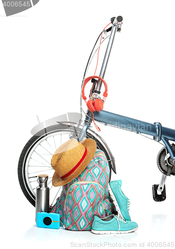 Image of The new modern bicycle and suitcase, sneakers, thermos