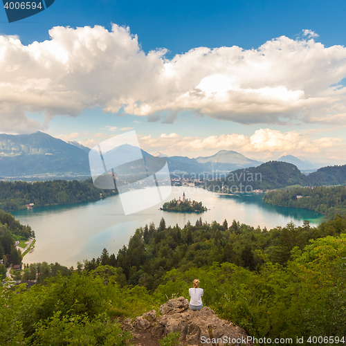 Image of Woman enjoying panoramic view of Lake Bled, Slovenia.