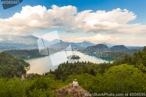 Image of Woman enjoying panoramic view of Lake Bled, Slovenia.