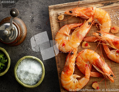 Image of roasted prawns on wooden cutting board