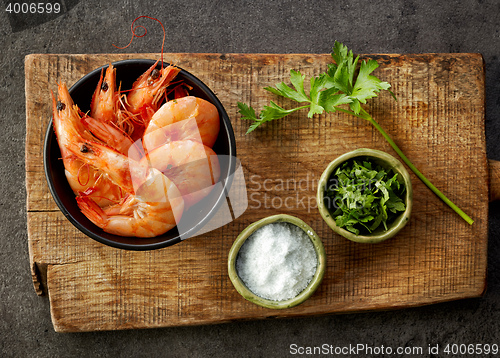 Image of roasted prawns on wooden cutting board