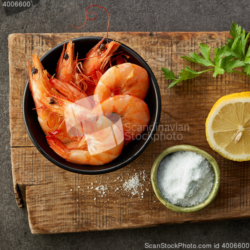 Image of roasted prawns on wooden cutting board