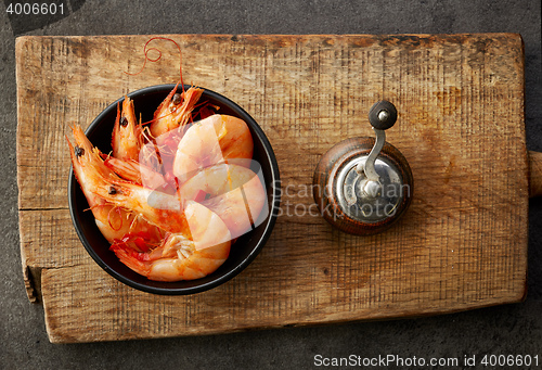 Image of roasted prawns on wooden cutting board