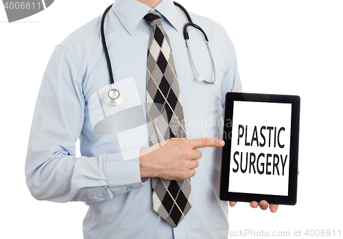 Image of Doctor holding tablet - Plastic surgery