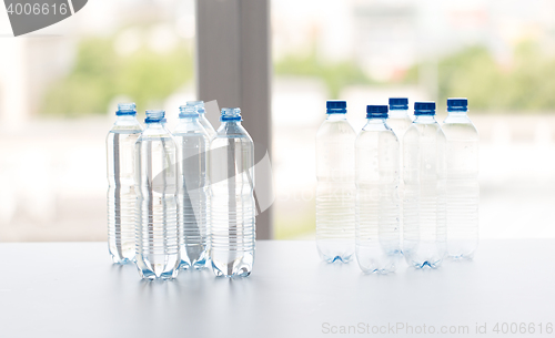 Image of close up of bottles with drinking water on table