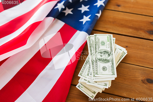 Image of close up of american flag and dollar cash money