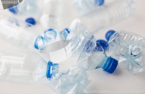 Image of close up of empty used plastic bottles on table