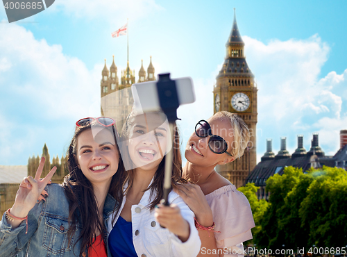 Image of group of smiling women taking selfie in london