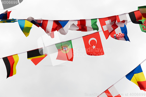 Image of close up of international flags garland decoration