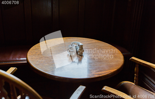 Image of close up of vintage table and chairs in irish pub