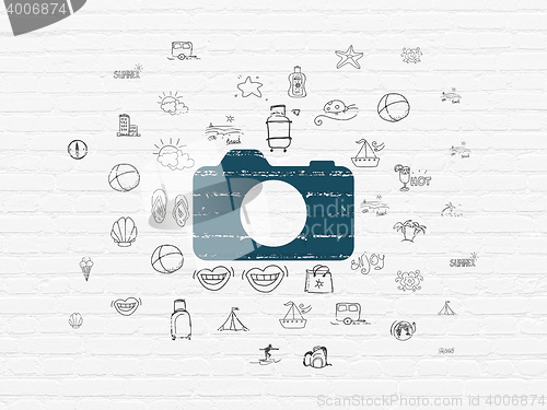 Image of Travel concept: Photo Camera on wall background