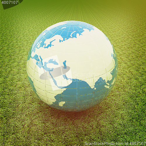 Image of Earth on green grass. 3D illustration. Vintage style.