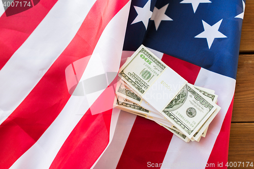 Image of close up of american flag and dollar cash money