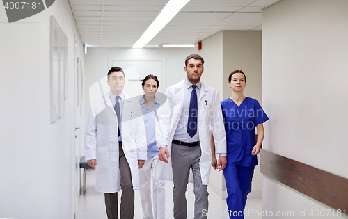 Image of group of medics walking along hospital