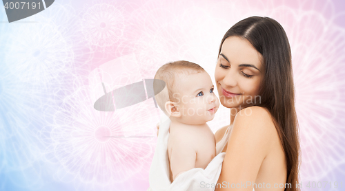 Image of happy mother holding adorable baby