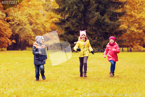 Image of group of happy little kids running outdoors