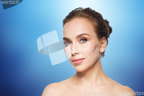 Image of beautiful young woman face over white background