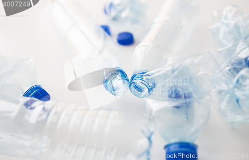 Image of close up of empty used plastic bottles on table